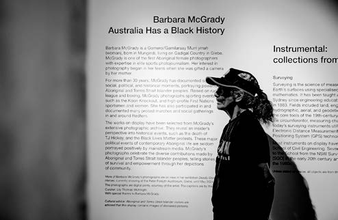 Aunty Barb standing at her exhibition ‘Australia has a Black History’ Photograph: Tom Psomotragos