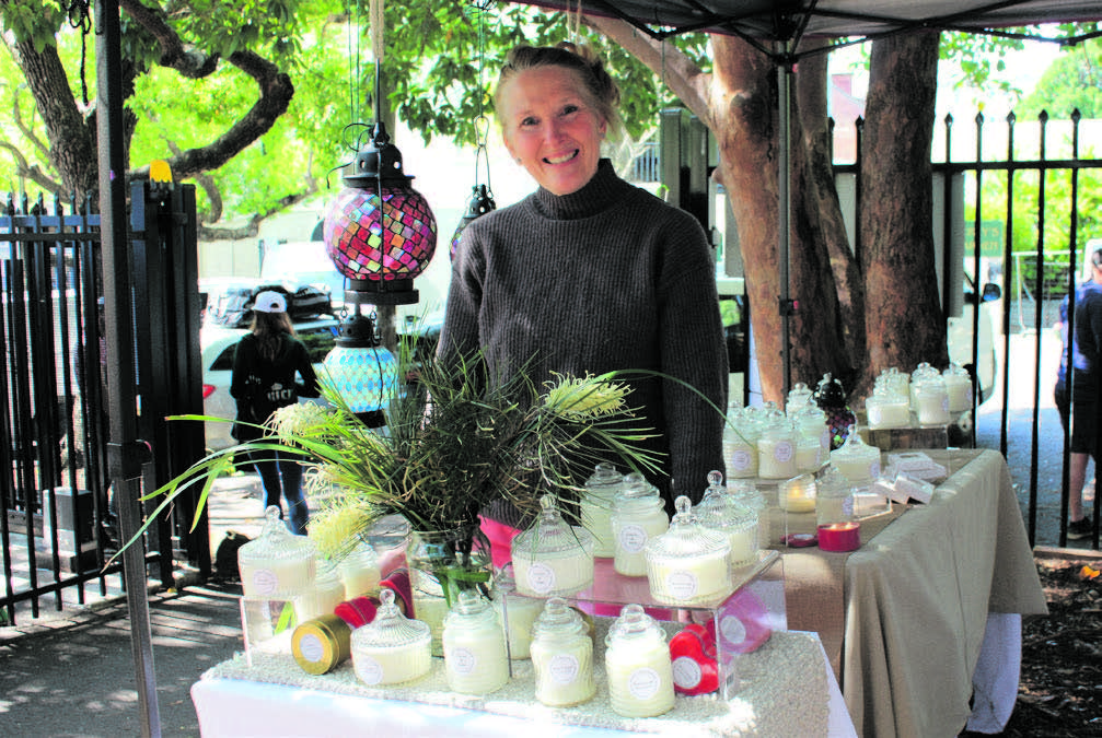 Jo, a stall owner selling handmade soy wax candles