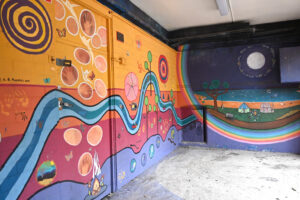 (Figure 1.3) The Riversong Mural at Glebe Public School, designed by Aunty Elaine Russell, and painted with the help of Liz Rooney and Glebe Public School students in 2011