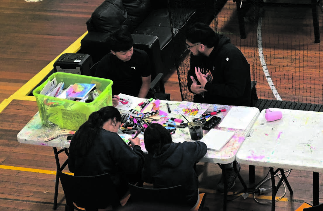 Habil running the after-school drop-in session