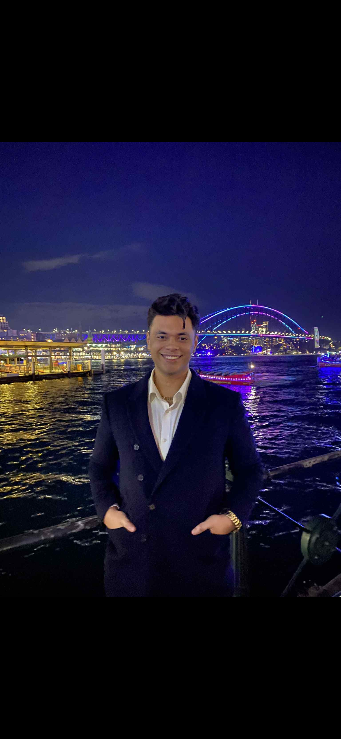Staff photo of Patrick with a backdrop of the Harbour Bridge